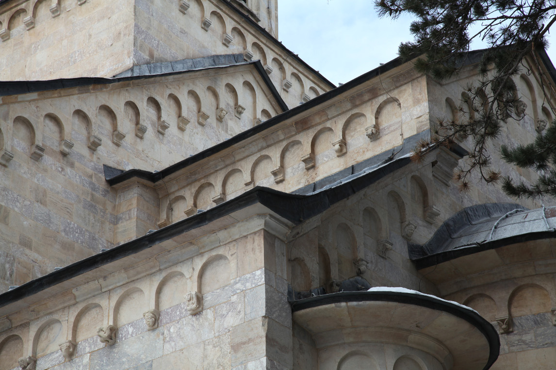 Visoki Dečani Monastery southeast exterior with glipse of apse and with gables and arched relief ornaments and chimera